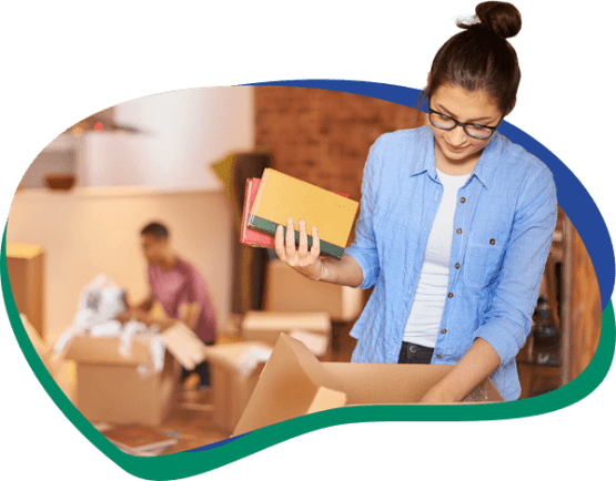 Girl packing box for overseas move