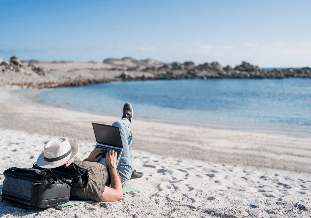Digital nomad working remotely on a beach in Thailand